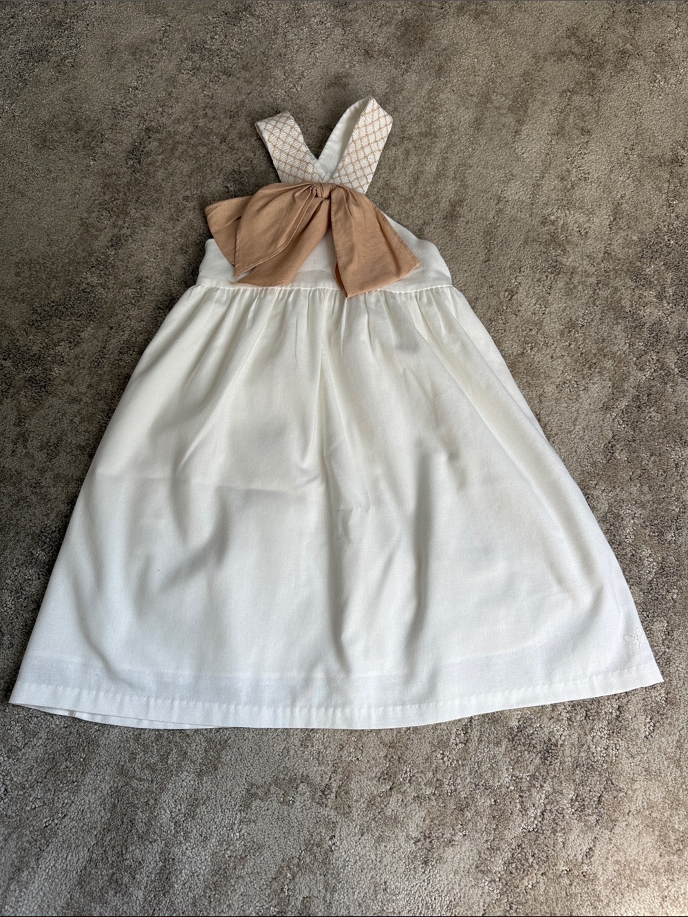 Dondolo children’s clothier Cream Girls' size 8 Sleeveless Dress with Tan Bow.
